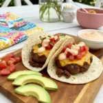 served low carb smash burger tacos with toppings and dipping sauce